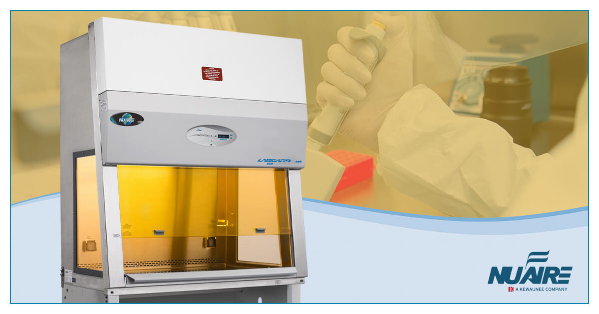 NuAire biosafety cabinet featuring yellow lighting that protects light-sensitive materials during pharmaceutical and research laboratory workflows